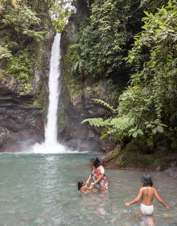 Family having an evening wash in Camiguin island, Philippines
