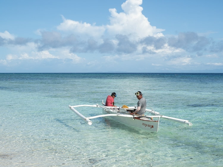 Father and son setting off in Camiguin, Philippines