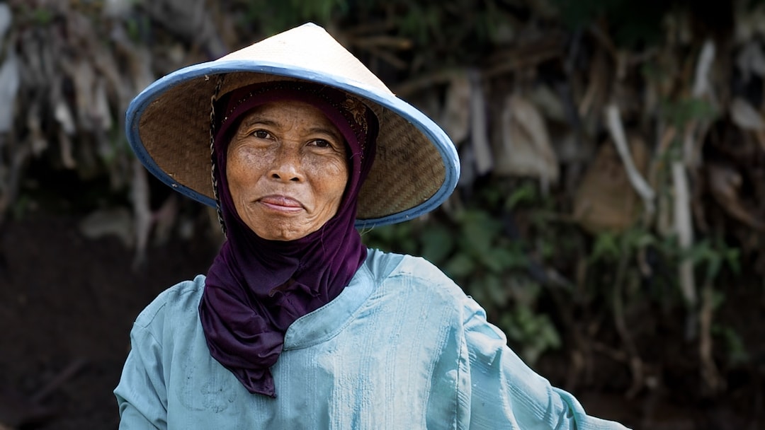 A portrait of Mrs. Tuwari working in the river