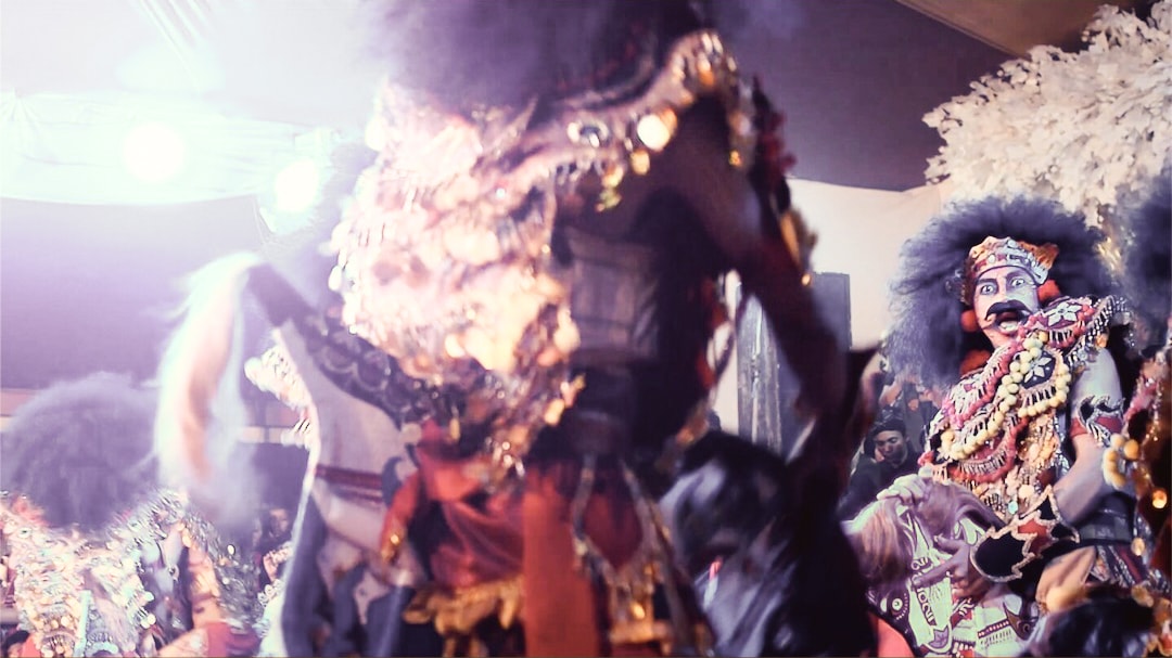 A Javanese dancer performing with a wooden horse in a mild trance.